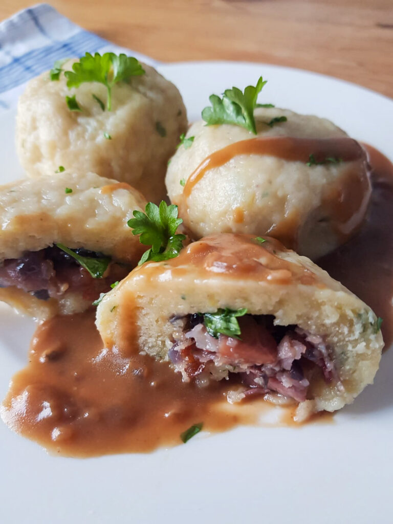 Kartoffelknödel/ potato dumplings with gravy and topped with parsley